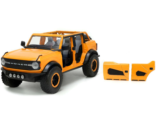 2021 Ford Bronco Orange Metallic with Extra Wheels "Just Trucks" Series 1/24 Diecast Model Car by Jada Jada