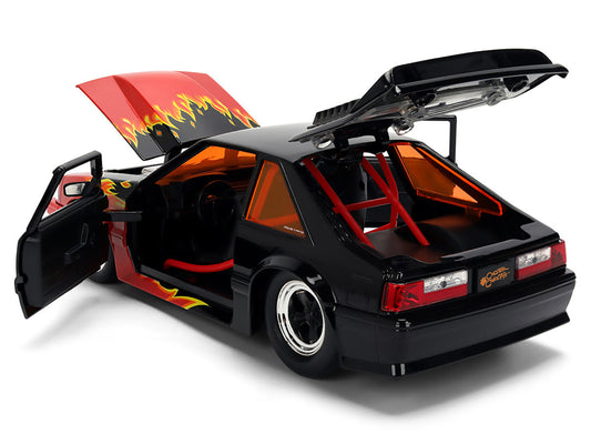 1989 Ford Mustang GT Black with Red Flame Graphics and Chester Cheetah Diecast Figure "Cheetos Flamin' Hot" "Hollywood Rides" Series 1/24 Diecast Model Car by Jada Jada