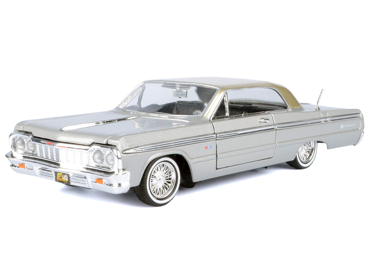 1964 Chevrolet Impala Lowrider Hard Top Silver Metallic with Gold Metallic Top "Get Low" Series 1/24 Diecast Model Car by Motormax Motormax