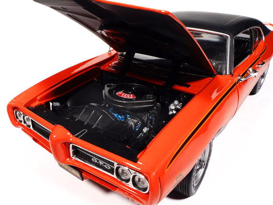1969 Pontiac GTO Judge Carousel Red with Black Stripes and Black Vinyl Top "Mecum Auctions" "American Muscle" Series 1/18 Diecast Model Car by Auto World Autoworld