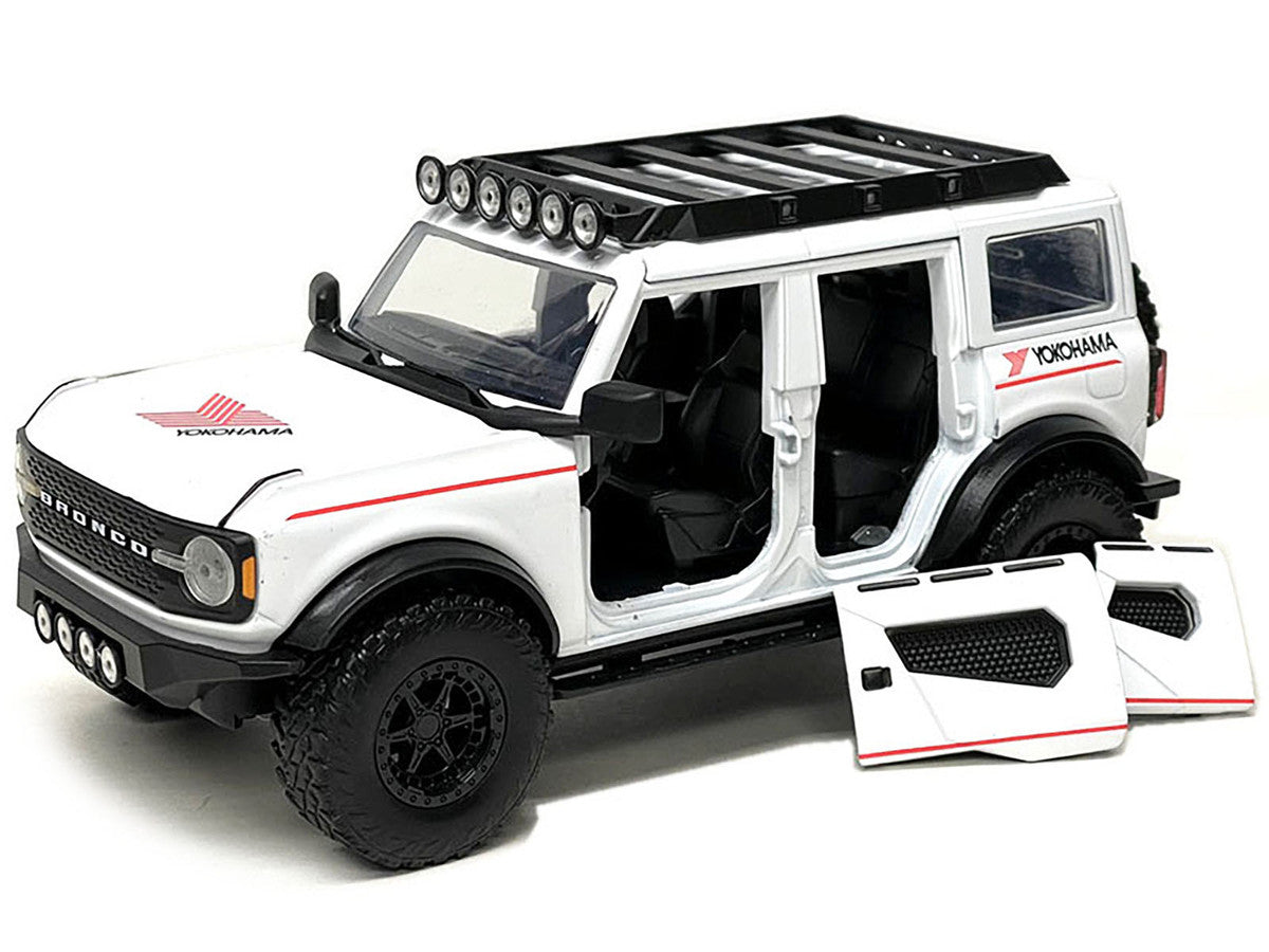 2021 Ford Bronco White with Red Stripes and Roof Rack "Yokohama Tires" "Just Trucks" Series 1/24 Diecast Model Car by Jada Jada