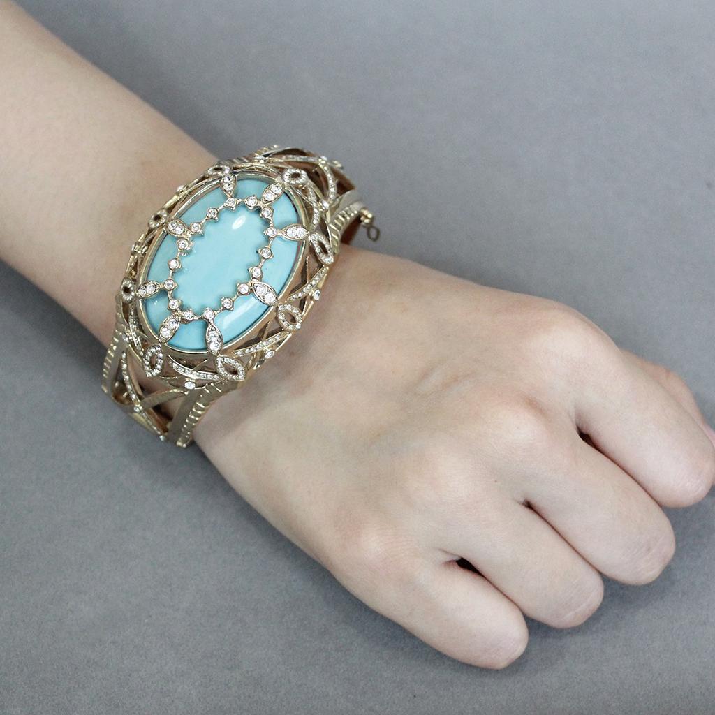 LO4348 - Gold Brass Bangle with Synthetic in Sea Blue Alamode