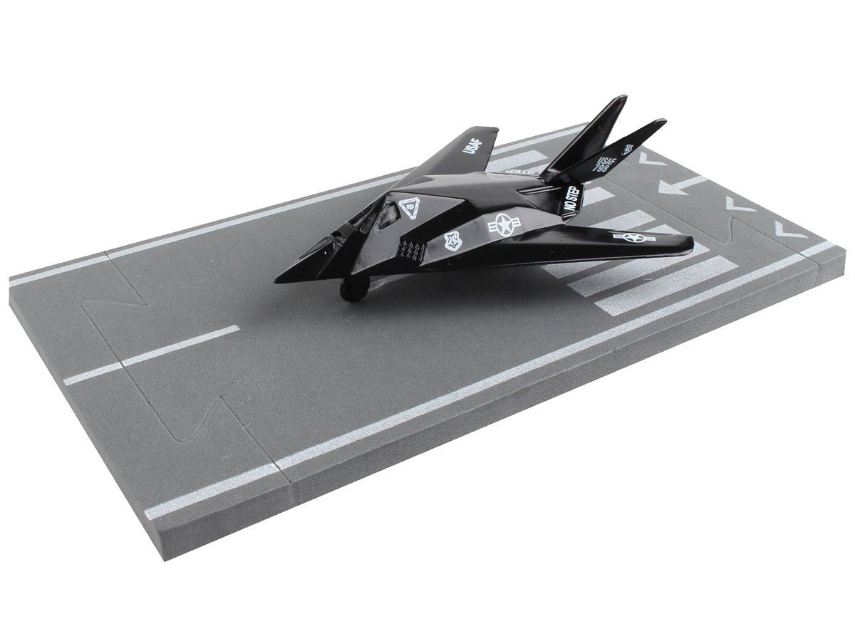 Lockheed F-117 Nighthawk Stealth Aircraft Black "United States Air Force" with Runway Section Diecast Model Airplane by Runway24-3