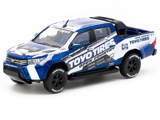 Toyota Hilux Pickup Truck RHD (Right Hand Drive) "Toyo Tires" White and Blue with Graphics "Hobby64" Series 1/64 Diecast Model Car by Tarmac Works