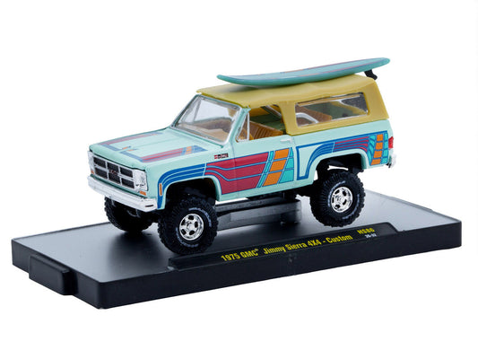 1975 GMC Jimmy Sierra 4x4 Light Blue with Graphics and Tan Top with Surfboard Limited Edition to 10560 pieces Worldwide 1/64 Diecast Model Car by M2 Machines M2