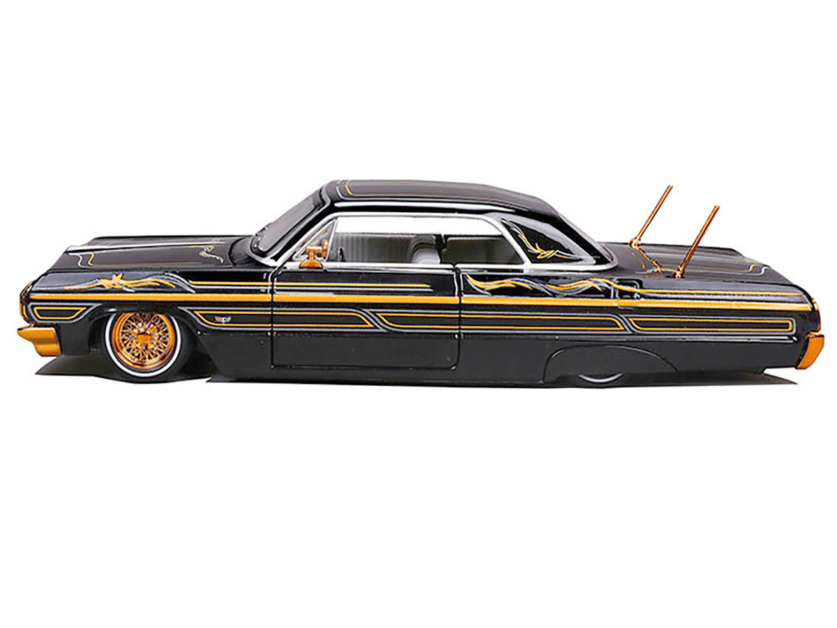 1964 Chevrolet Impala SS Lowrider Black Metallic with Gold Graphics and Gray Interior "Lowriders" "Maisto Design" Series 1/26 Diecast Model Car by Maisto Maisto
