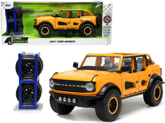 2021 Ford Bronco Orange Metallic with Extra Wheels "Just Trucks" Series 1/24 Diecast Model Car by Jada Jada