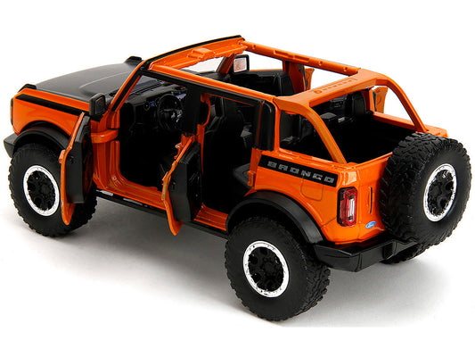 2021 Ford Bronco Open-Top Orange with Black Stripes and Hood with Extra Wheels "Just Trucks" Series 1/24 Diecast Model Car by Jada Jada