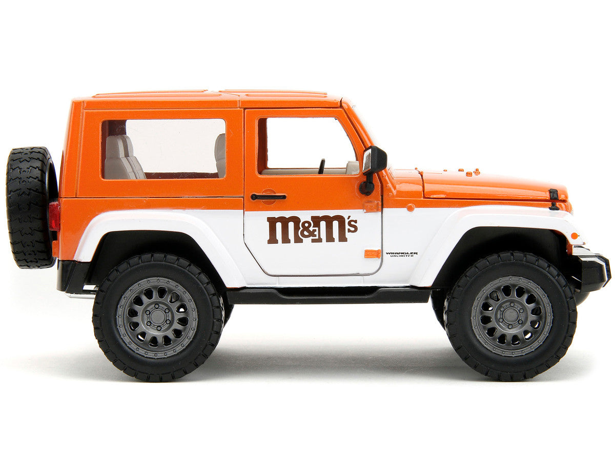 2007 Jeep Wrangler Orange Metallic and White and Orange M&M Diecast Figure "M&M's" "Hollywood Rides" Series 1/24 Diecast Model Car by Jada Jada