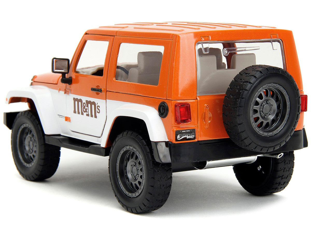 2007 Jeep Wrangler Orange Metallic and White and Orange M&M Diecast Figure "M&M's" "Hollywood Rides" Series 1/24 Diecast Model Car by Jada Jada