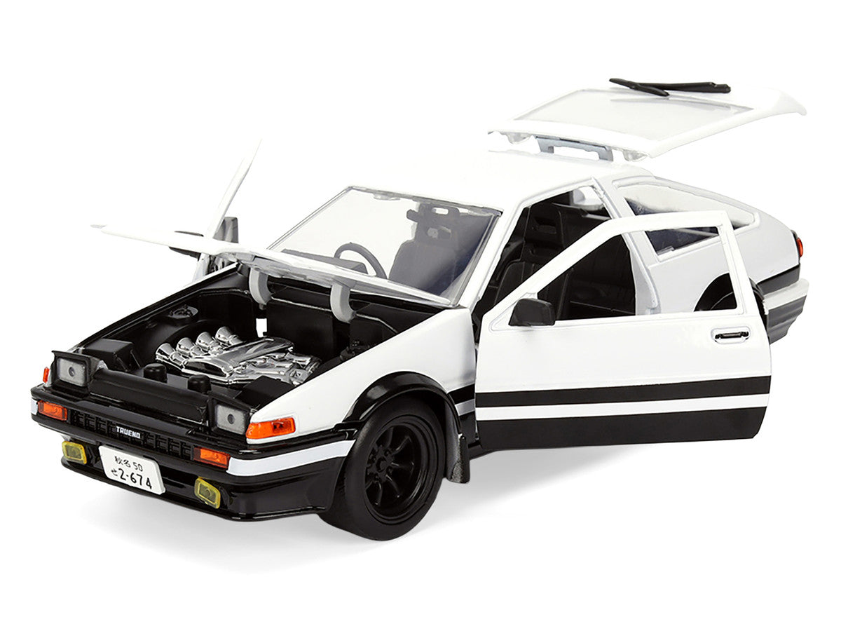 Toyota Trueno (AE86) RHD (Right Hand Drive) White and Black with Graphics and Takumi Diecast Figure "Initial D" (1998-2021) TV Series "Anime Hollywood Rides" Series 1/24 Diecast Model by Jada Jada