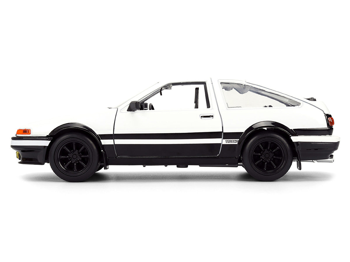 Toyota Trueno (AE86) RHD (Right Hand Drive) White and Black with Graphics and Takumi Diecast Figure "Initial D" (1998-2021) TV Series "Anime Hollywood Rides" Series 1/24 Diecast Model by Jada Jada