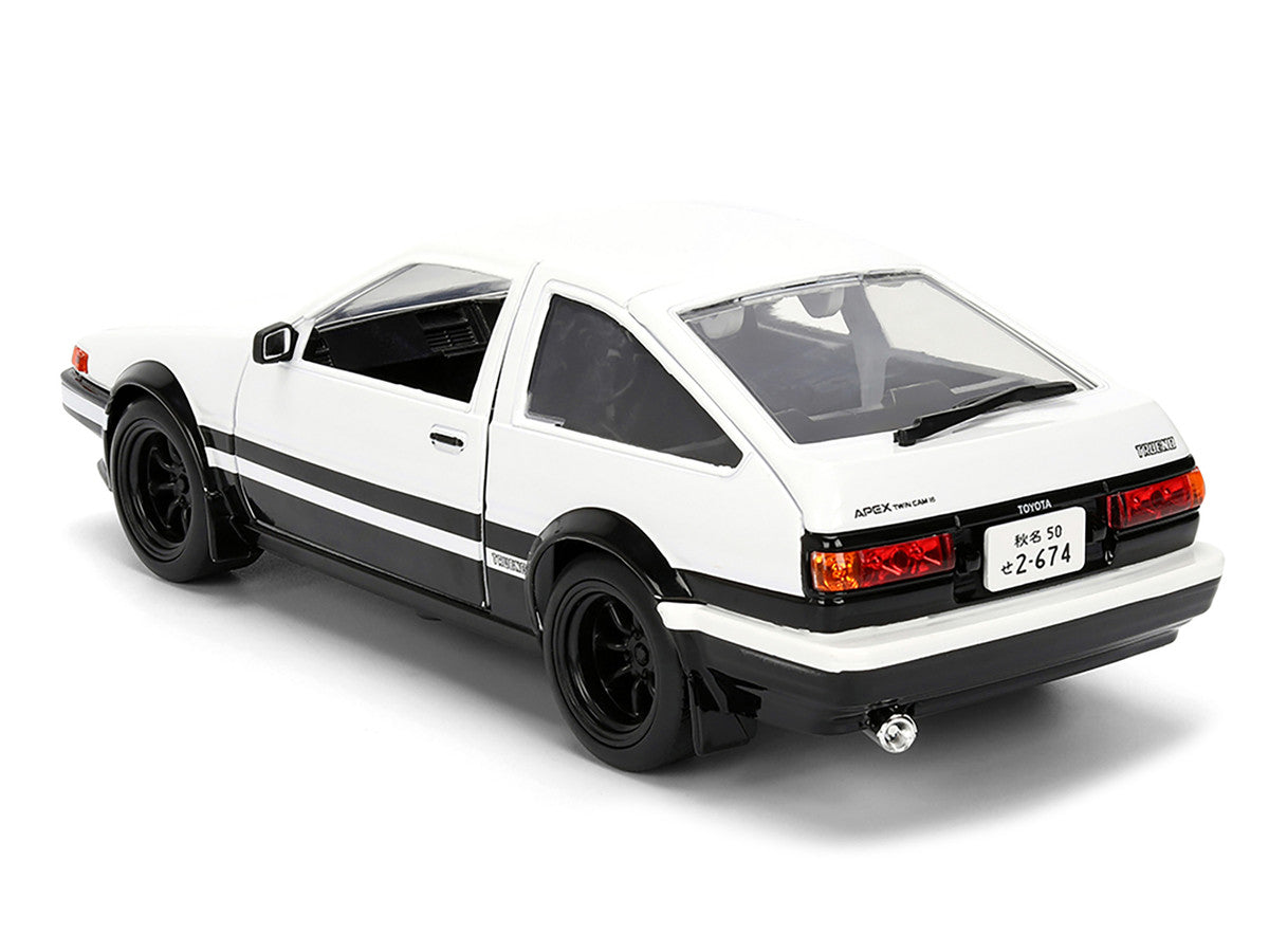Toyota Trueno (AE86) RHD (Right Hand Drive) White and Black with Graphics and Takumi Diecast Figure "Initial D" (1998-2021) TV Series "Anime Hollywood Rides" Series 1/24 Diecast Model by Jada Jada