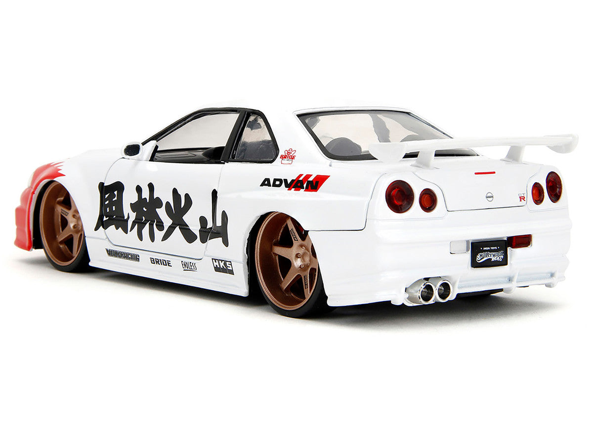 2002 Nissan Skyline GT-R (R34) RHD (Right Hand Drive) White with Red Graphics and Ryu Diecast Figure "Street Fighter" Video Game "Anime Hollywood Rides" Series 1/24 Diecast Model Car by Jada Jada