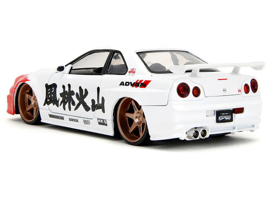 2002 Nissan Skyline GT-R (R34) RHD (Right Hand Drive) White with Red Graphics and Ryu Diecast Figure "Street Fighter" Video Game "Anime Hollywood Rides" Series 1/24 Diecast Model Car by Jada Jada