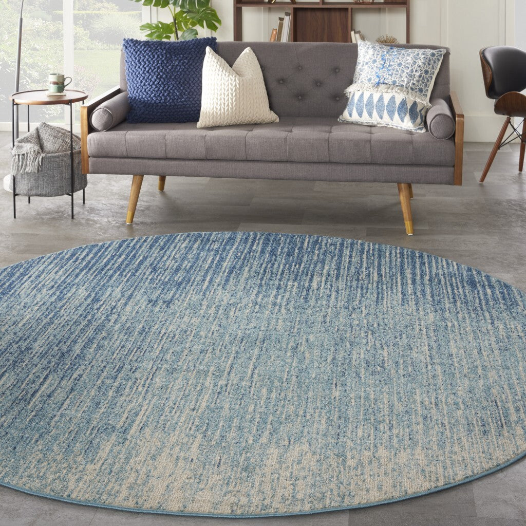 8' Blue and Ivory Abstract Power Loom Round Rug