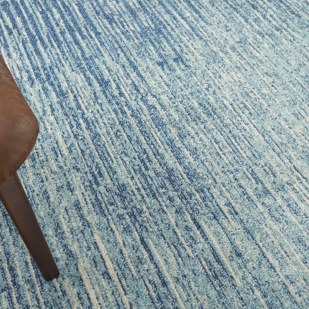 8' Blue and Ivory Abstract Power Loom Round Rug