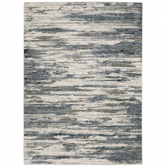 5' X 8' Blue Grey Beige And Brown Abstract Power Loom Stain Resistant Area Rug