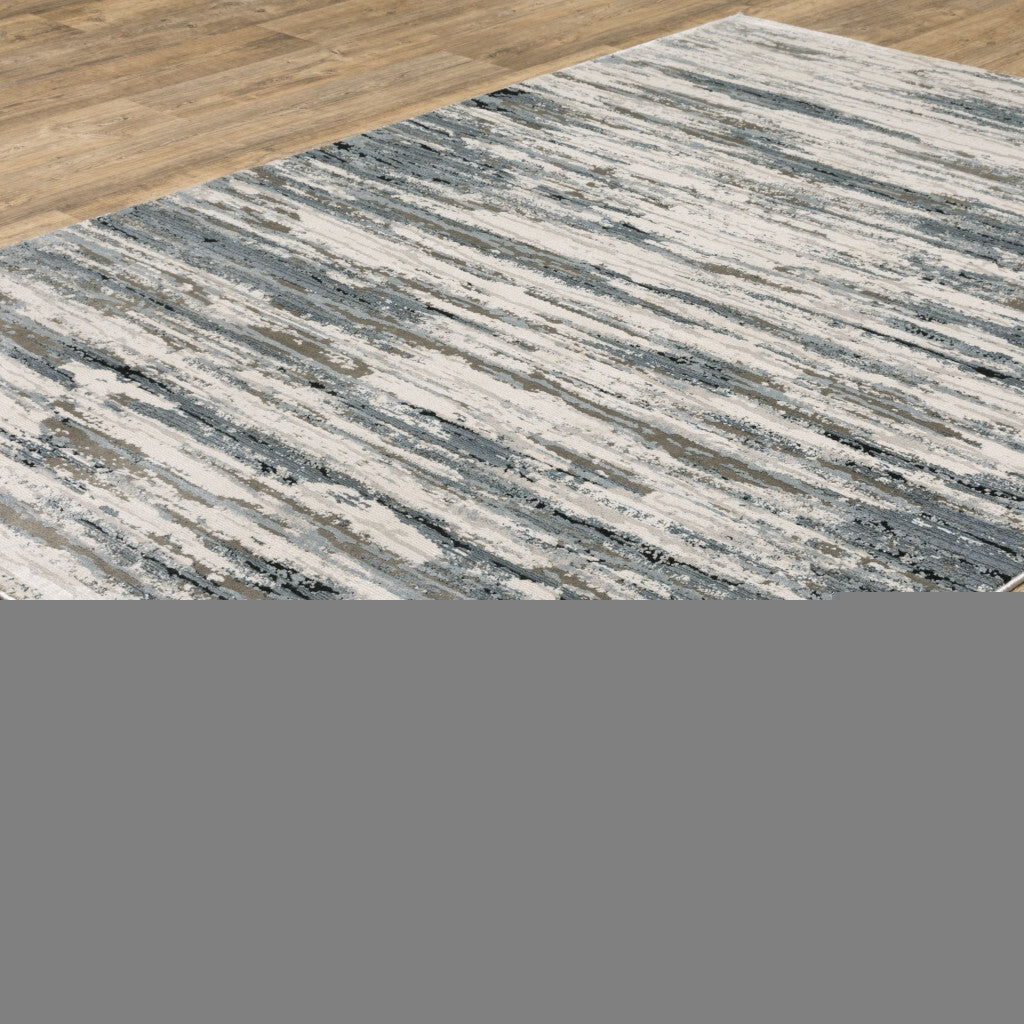 5' X 8' Blue Grey Beige And Brown Abstract Power Loom Stain Resistant Area Rug