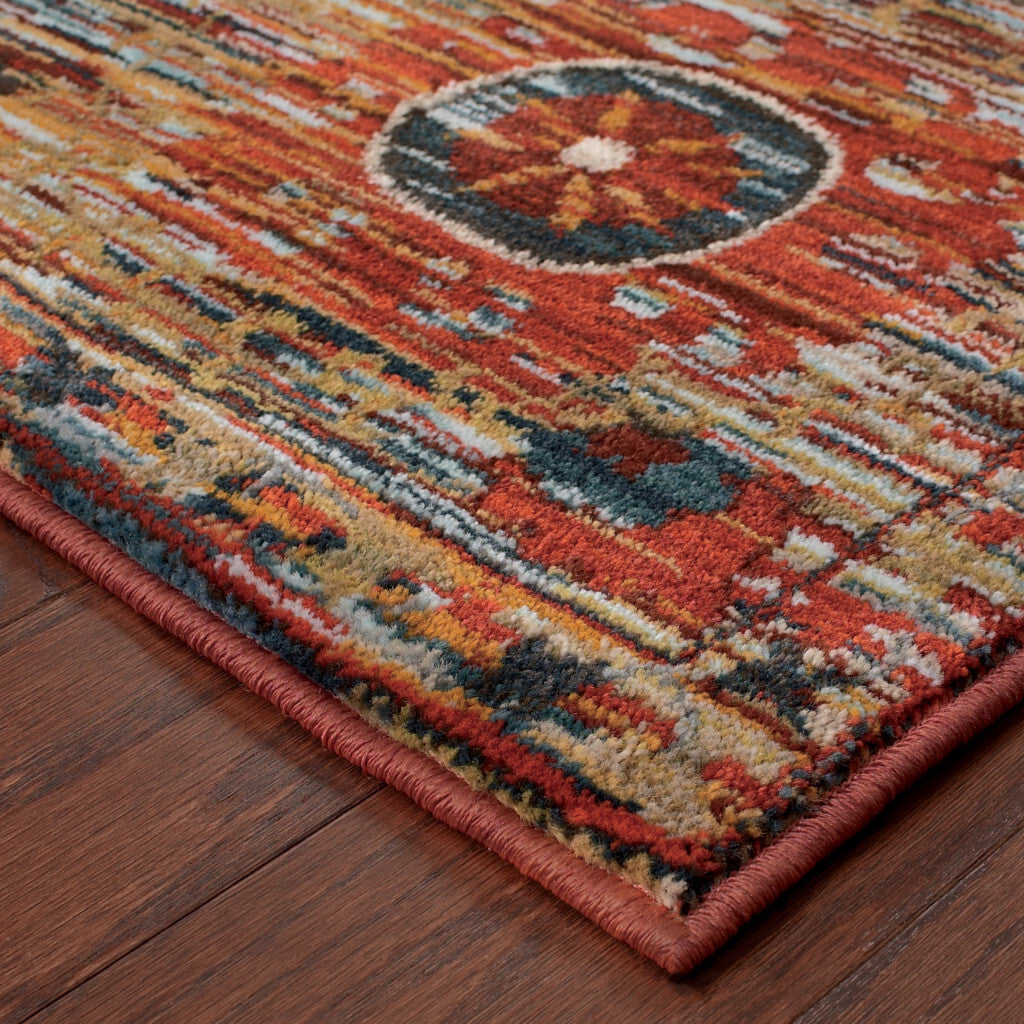5' X 8' Red Gold Orange Green Ivory Rust And Blue Floral Power Loom Stain Resistant Area Rug