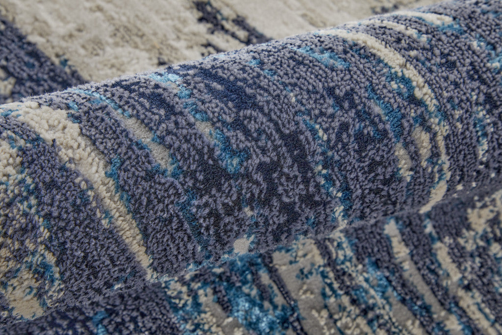 8' Tan Blue And Ivory Abstract Power Loom Distressed Runner Rug