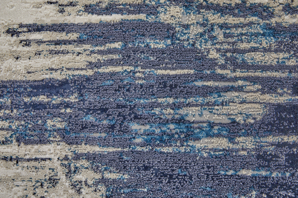 8' Tan Blue And Ivory Abstract Power Loom Distressed Runner Rug