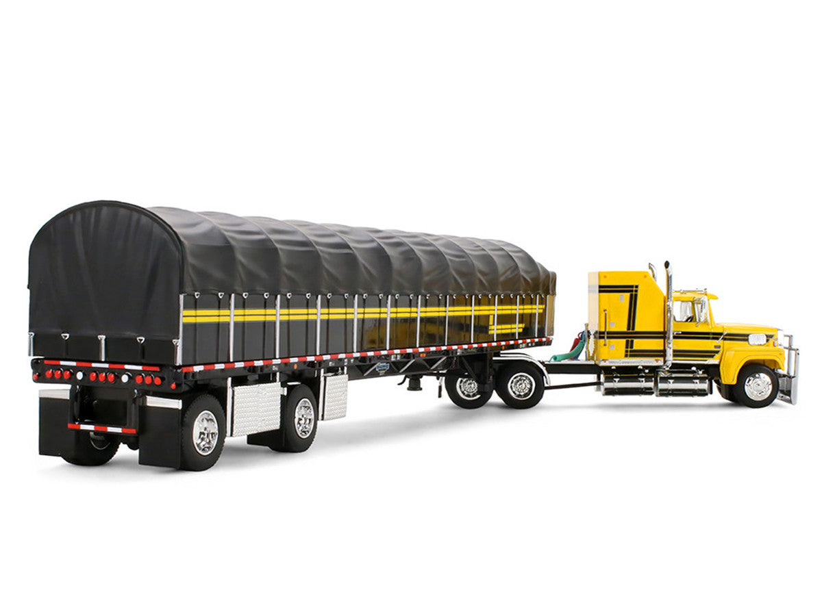 Ford LTL 9000 with 60" Aerodyne Sleeper and 53' Wilson Roadbrute Flatbed Trailer with Covered Wagon Yellow with Black Stripes 1/64 Diecast Model by DCP/First Gear-1