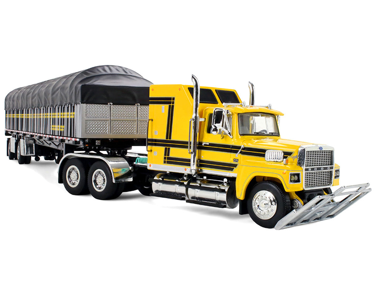 Ford LTL 9000 with 60" Aerodyne Sleeper and 53' Wilson Roadbrute Flatbed Trailer with Covered Wagon Yellow with Black Stripes 1/64 Diecast Model by DCP/First Gear-3