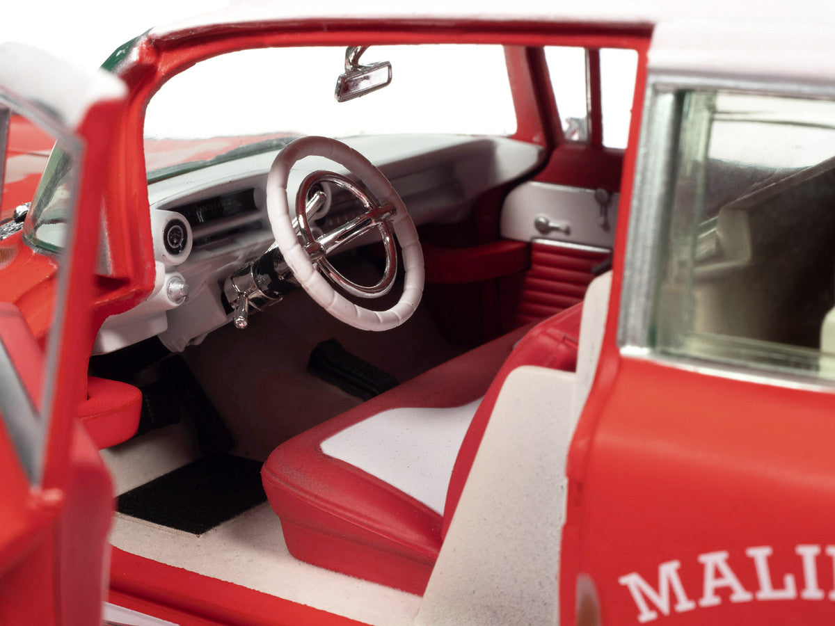 1959 Cadillac Eldorado Ambulance Red with White Top "Malibu Beach Rescue" (Weathered) with Surfboards on Roof "Surf Shark" 1/18 Diecast Model Car by Auto World Autoworld