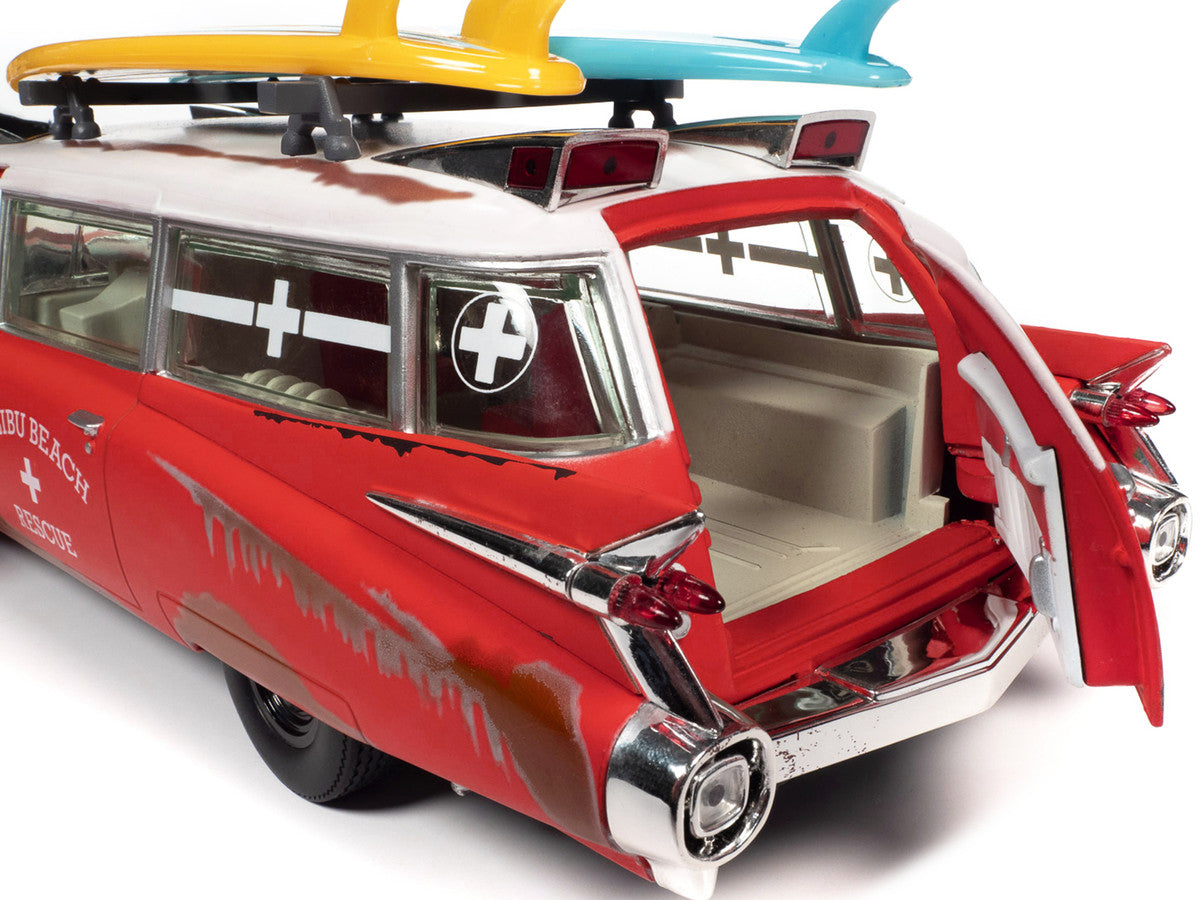1959 Cadillac Eldorado Ambulance Red with White Top "Malibu Beach Rescue" (Weathered) with Surfboards on Roof "Surf Shark" 1/18 Diecast Model Car by Auto World Autoworld