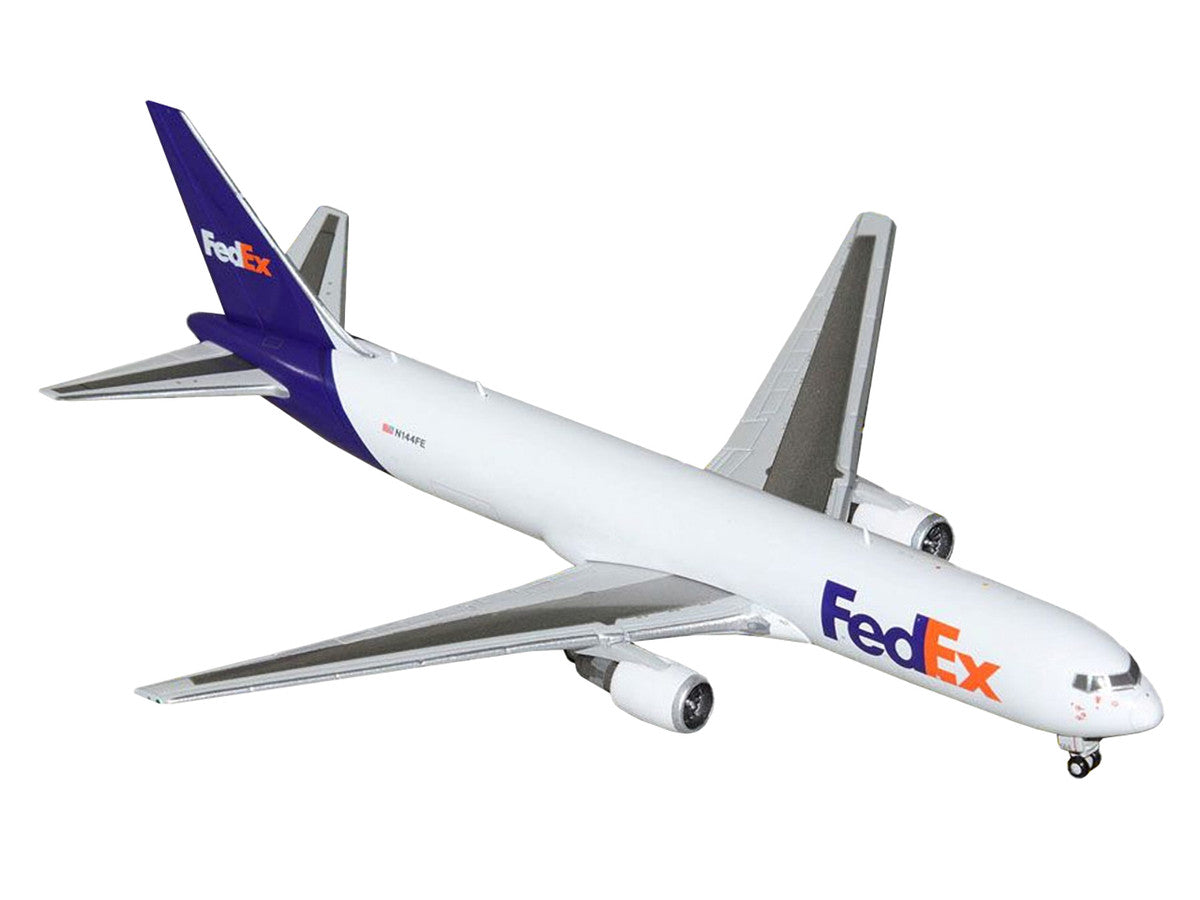 Boeing 767-300F Commercial Aircraft "FedEx (Federal Express)" (N144FE) White with Purple Tail 1/400 Diecast Model Airplane by GeminiJets-1