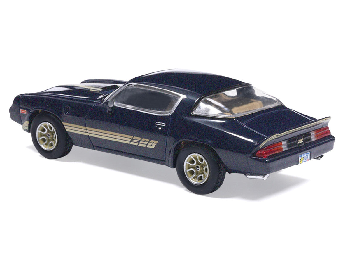 1981 Chevrolet Camaro Z28 Dark Blue Metallic with Gold Stripes and Interior 1/64 Diecast Model Car by IXO Models IXO