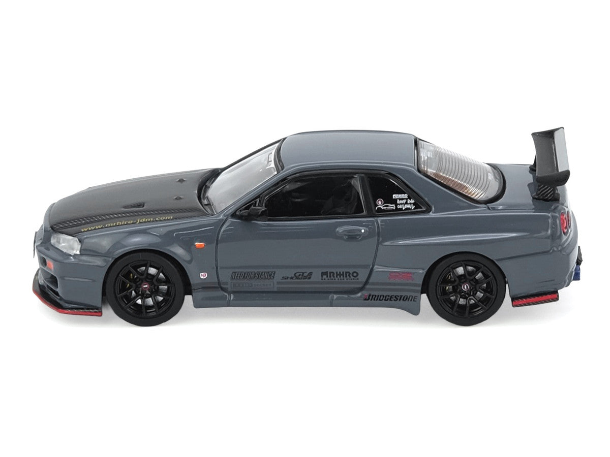 Nissan Skyline GT-R (R34) "Top Secret" RHD (Right Hand Drive) Stealth Gray with Carbon Hood "GTSHOW 2025 Event Edition" 1/64 Diecast Model Car by Inno Models-0