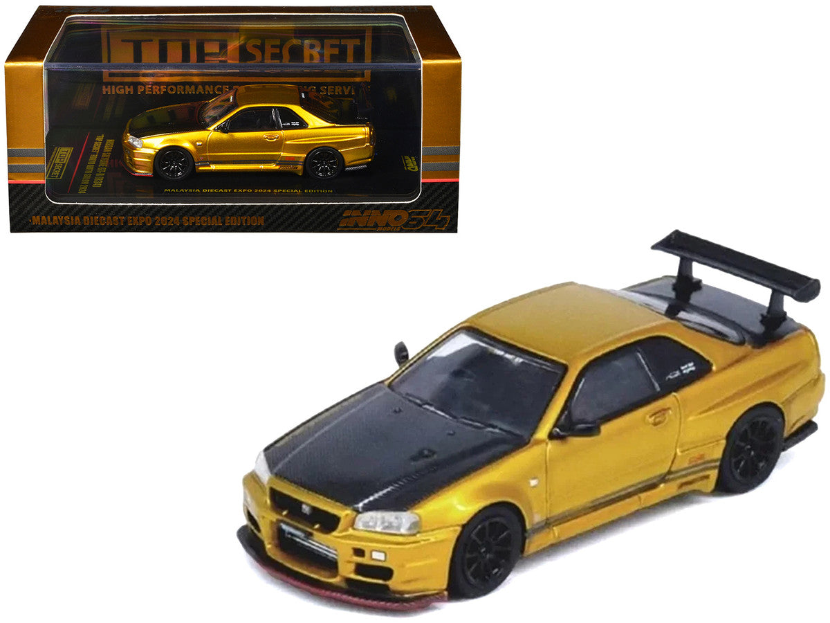 Nissan Skyline GT-R (R34) "Top Secret" RHD (Right Hand Drive) Gold Metallic with Carbon Hood and Trunk "Tokyo Auto Salon 2024 - Malaysia Diecast Expo 2024" 1/64 Diecast Model Car by Inno Models Inno Models