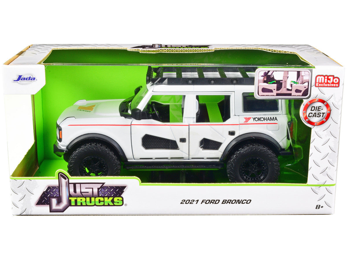 2021 Ford Bronco White with Red Stripes and Roof Rack "Yokohama Tires" "Just Trucks" Series 1/24 Diecast Model Car by Jada Jada