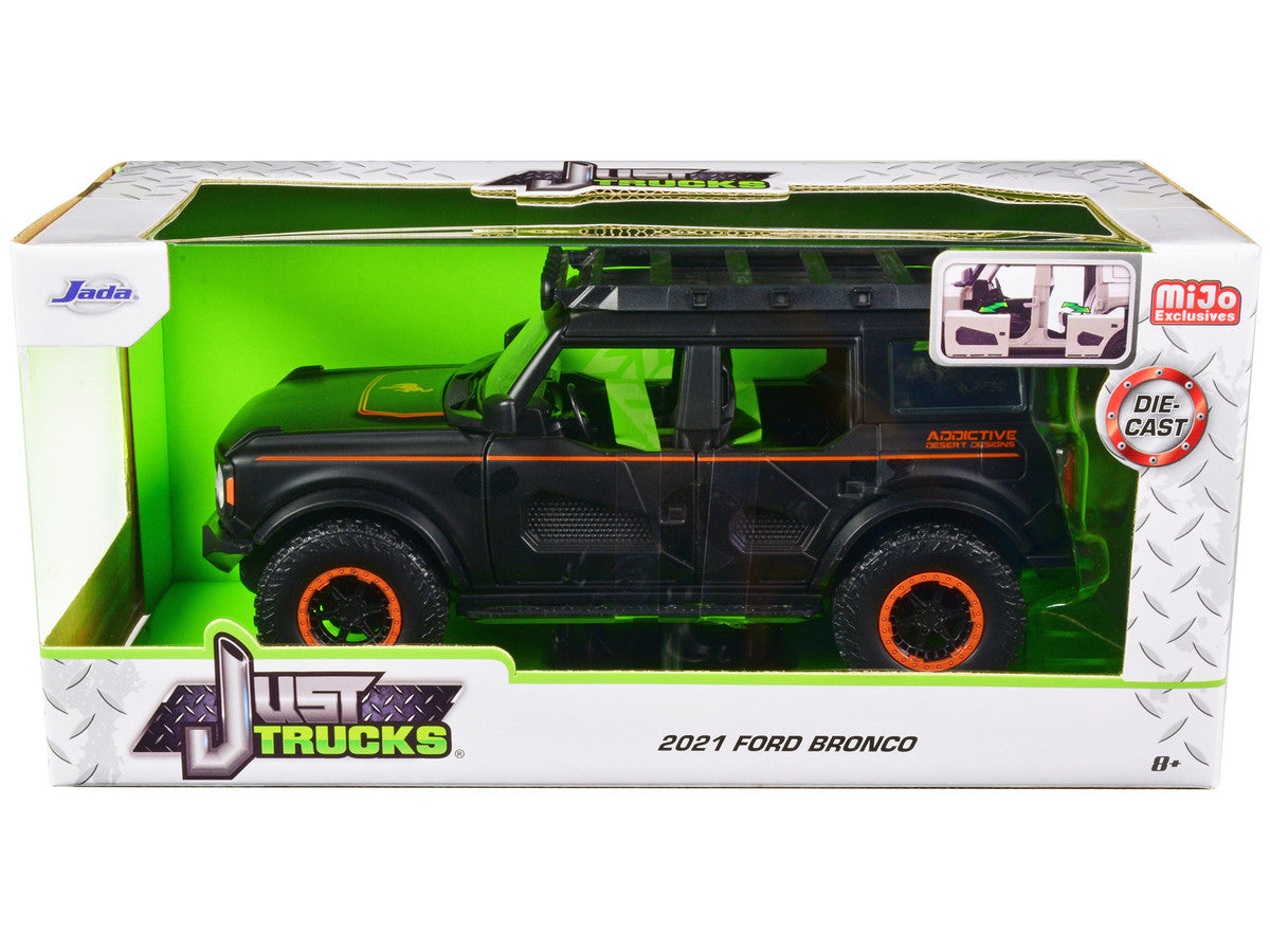 2021 Ford Bronco Matt Black with Orange Stripes and Roof Rack "Addictive Desert Designs" "Just Trucks" Series 1/24 Diecast Model Car by Jada Jada