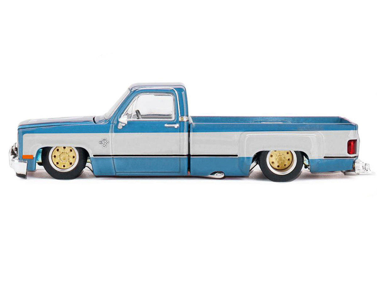 Chevrolet Silverado Dually Pickup Truck "Vintage Spec V1" Light Blue Metallic with White Sides and Interior (Designed by Jun Imai) "Kaido House" Special 1/64 Diecast Model Car by Mini GT Mini GT
