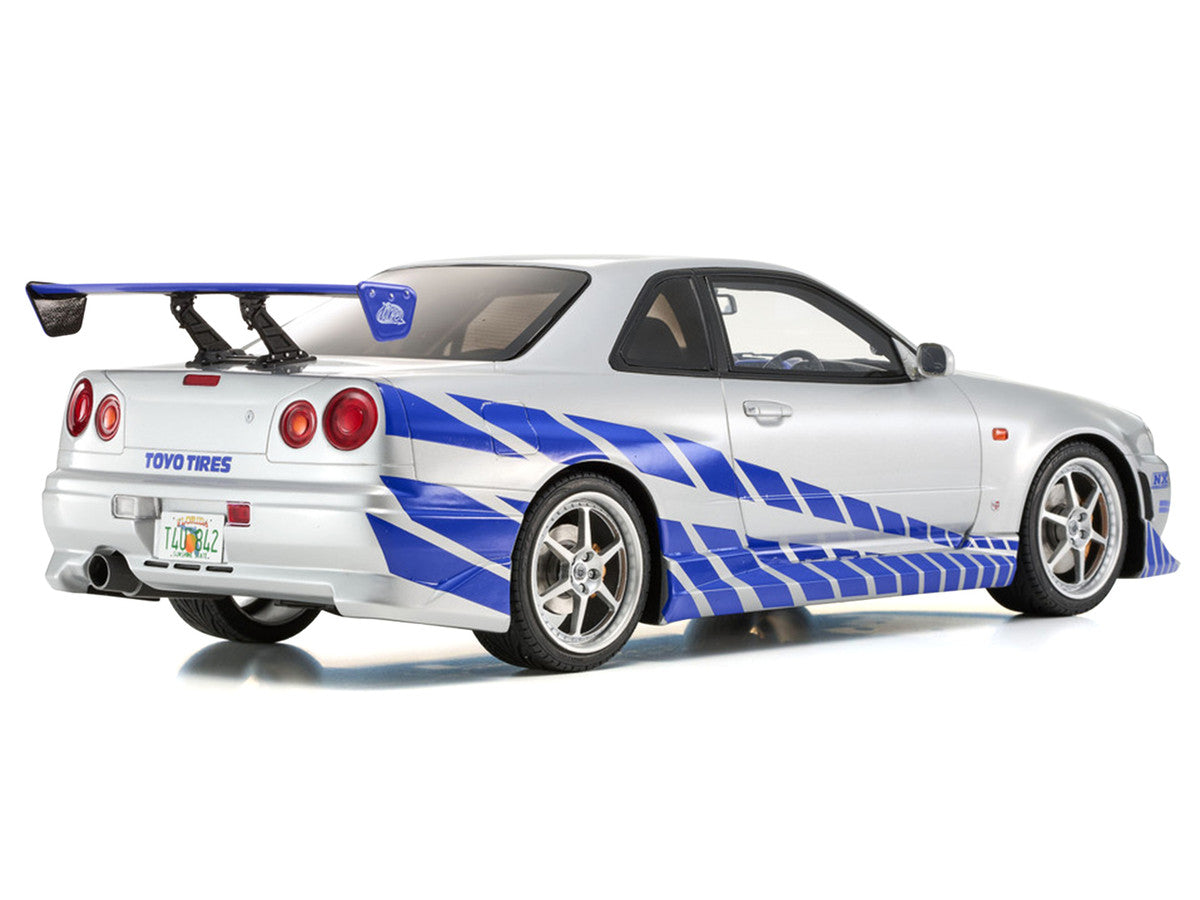 Nissan Skyline GT-R (R34) RHD (Right Hand Drive) Silver Metallic with Blue Graphics "2 Fast 2 Furious" (2003) Movie 1/12 Model Car by Kyosho Kyosho