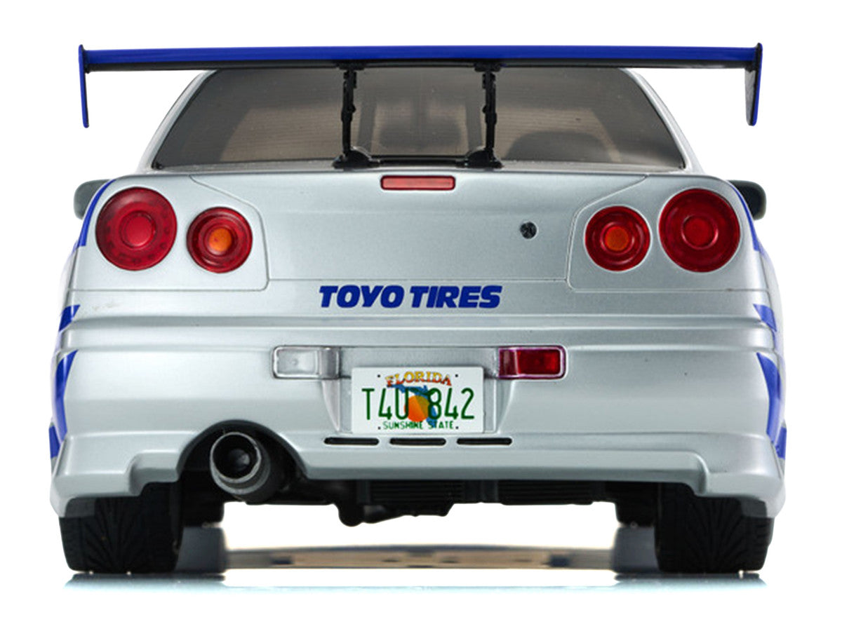 Nissan Skyline GT-R (R34) RHD (Right Hand Drive) Silver Metallic with Blue Graphics "2 Fast 2 Furious" (2003) Movie 1/12 Model Car by Kyosho Kyosho
