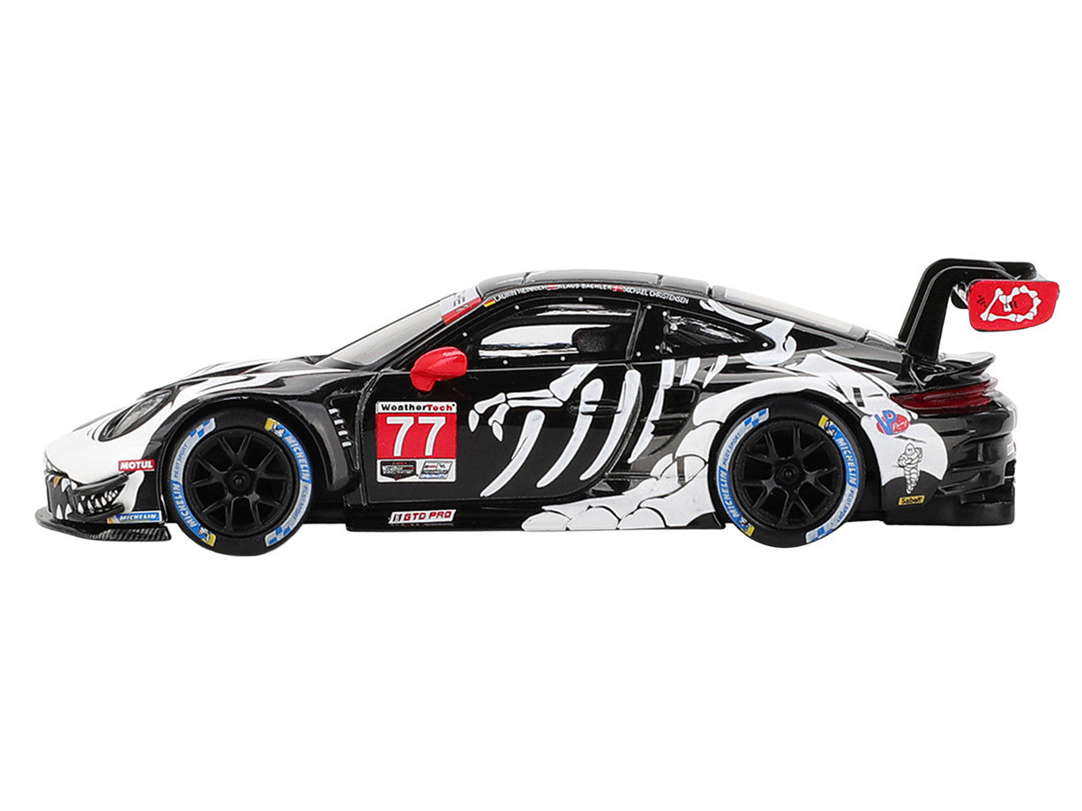 Porsche 911 GT3 R #77 Klaus Bachler - Laurin Heinrich - Michael Christensen "AO Racing Skeleton Rexy" GTD Pro IMSA "Petit Le Mans" (2025) Limited Edition 1/64 Diecast Model Car by Mini GT Mini GT
