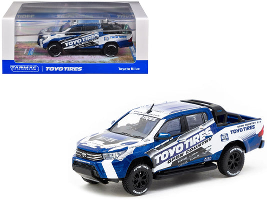 Toyota Hilux Pickup Truck RHD (Right Hand Drive) "Toyo Tires" White and Blue with Graphics "Hobby64" Series 1/64 Diecast Model Car by Tarmac Works