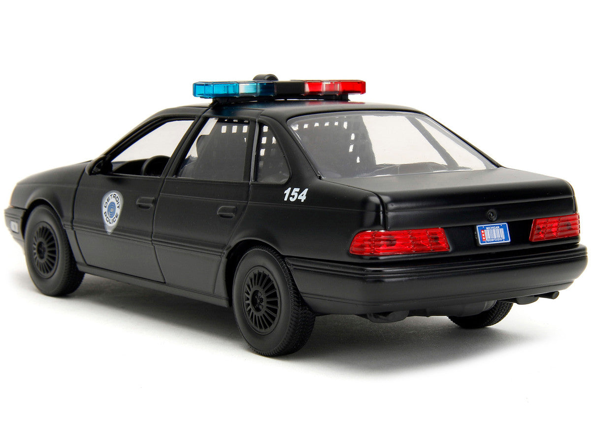 Ford Taurus OCP Matt Black "Detroit Police" and Robocop Diecast Figure 35th Anniversary "Robocop" (1987) Movie "Hollywood Rides" Series 1/24 Diecast Model Car by Jada Jada