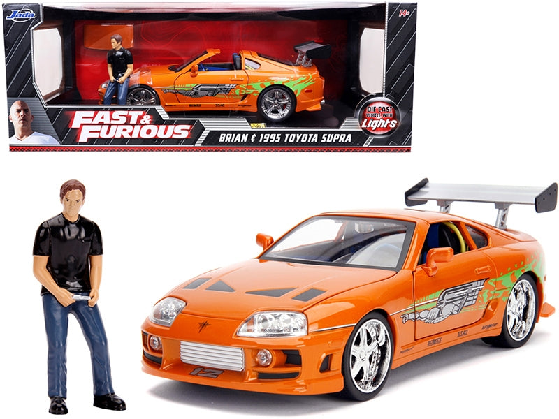 1995 Toyota Supra Orange Metallic with Lights and Brian Figurine "Fast & Furious" Movie 1/18 Diecast Model Car by Jada