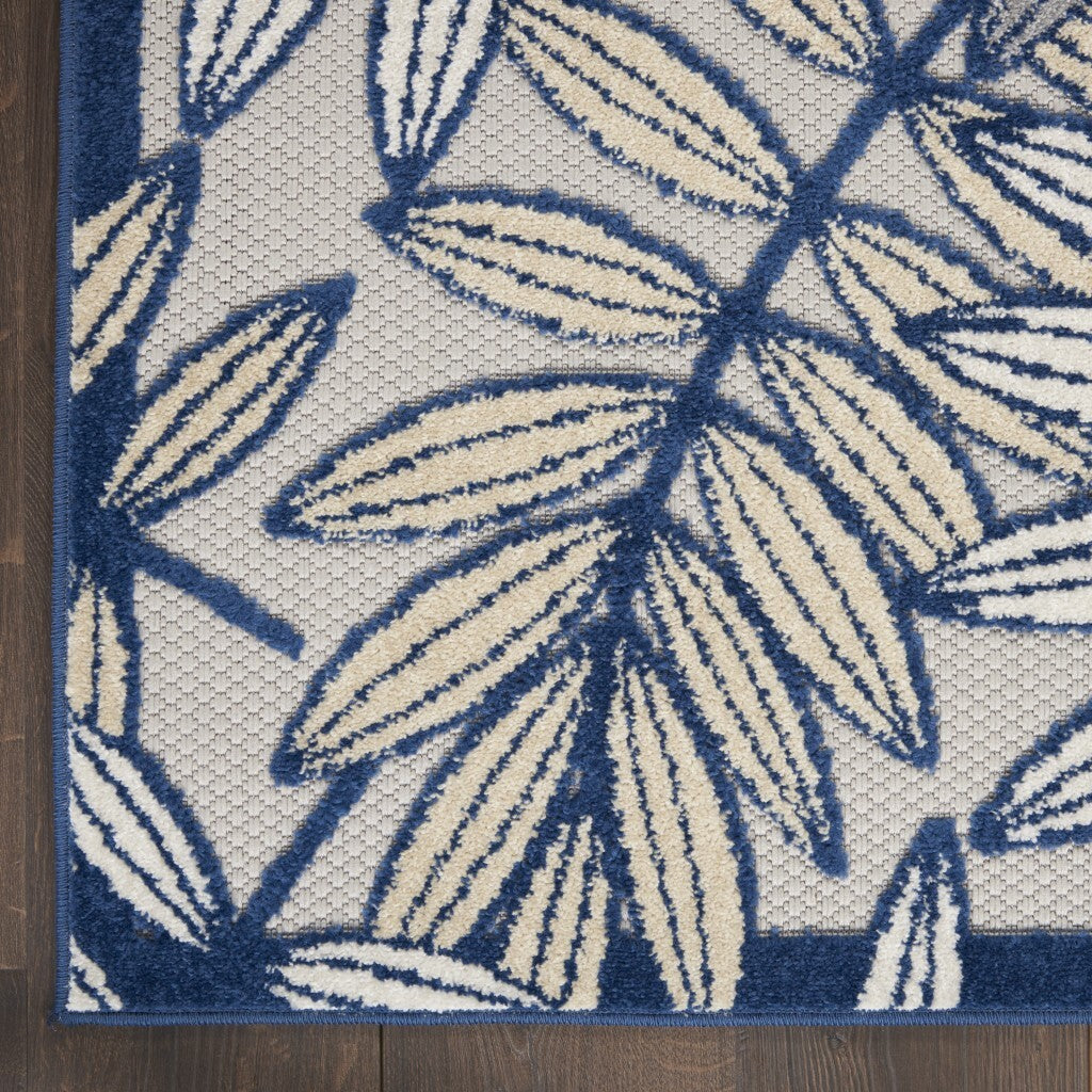 7' x 10' Ivory and Navy Leaves Indoor Outdoor Area Rug