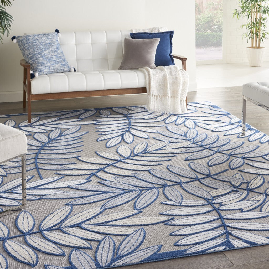 7' x 10' Ivory and Navy Leaves Indoor Outdoor Area Rug