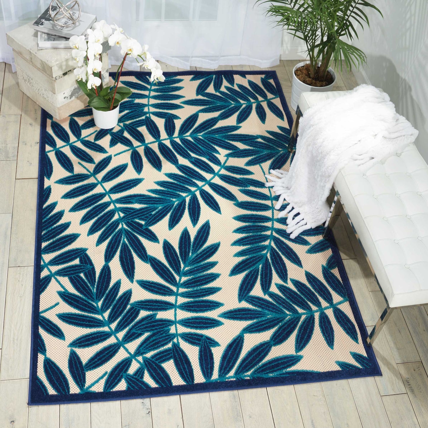 8' x 11' Navy and Beige Leaves Indoor Outdoor Area Rug