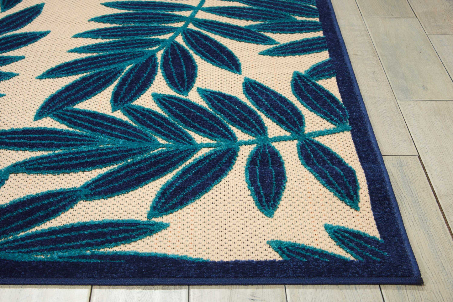 8' x 11' Navy and Beige Leaves Indoor Outdoor Area Rug