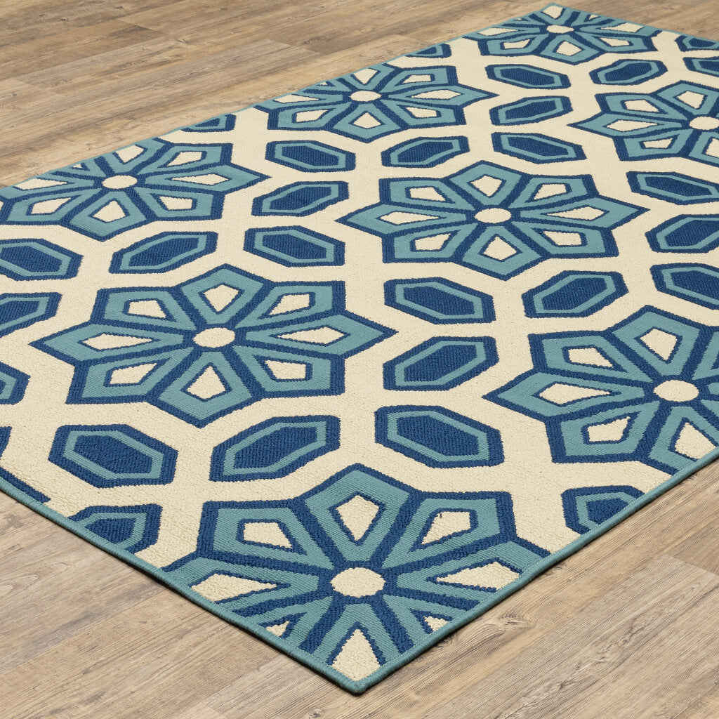 7' x 10' Ivory and Blue Geometric Stain Resistant Indoor Outdoor Area Rug