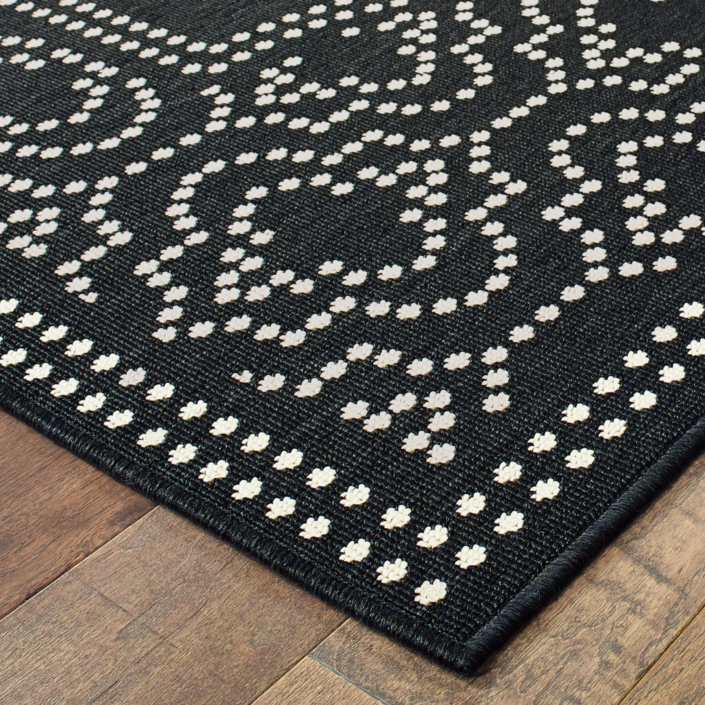 8' x 11' Black and Ivory Stain Resistant Indoor Outdoor Area Rug