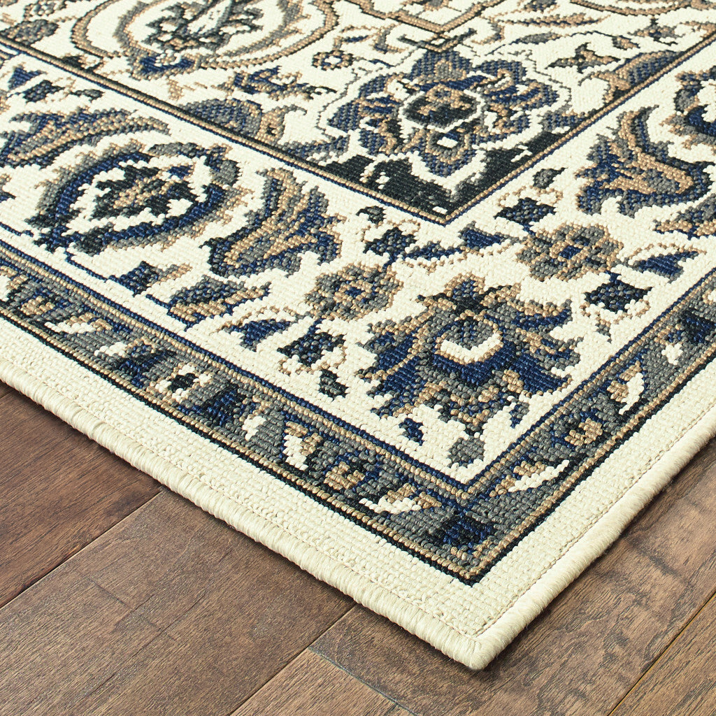 7' x 10' Ivory and Blue Oriental Stain Resistant Indoor Outdoor Area Rug